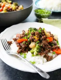 This cheap and easy Korean Beef recipe is made with ground beef instead of flank steak. It's simmered in a simple, yet flavorful sauce with added vegetables for a well-rounded meal. Serve with rice, and you've got a delicious dinner ready in 20 minutes or less!