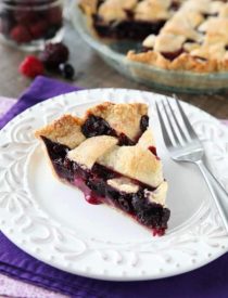 This Mixed Berry Pie uses a frozen blend of raspberries, blackberries, and blueberries which is perfect when fresh berries are out of season. No need to cook the filling ahead of time. Simply fill and bake. Enjoy this pie for the holidays or any day of the year!