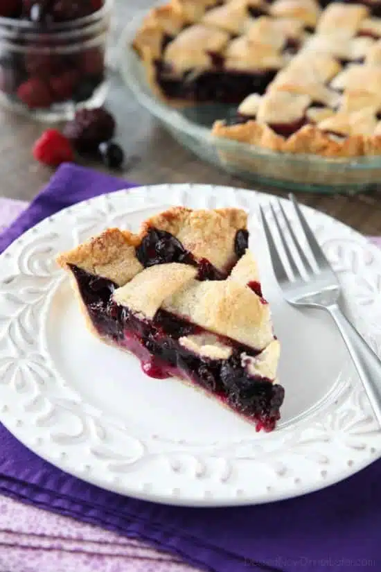 This Mixed Berry Pie uses a frozen blend of raspberries, blackberries, and blueberries which is perfect when fresh berries are out of season. No need to cook the filling ahead of time. Simply fill and bake. Enjoy this pie for the holidays or any day of the year!