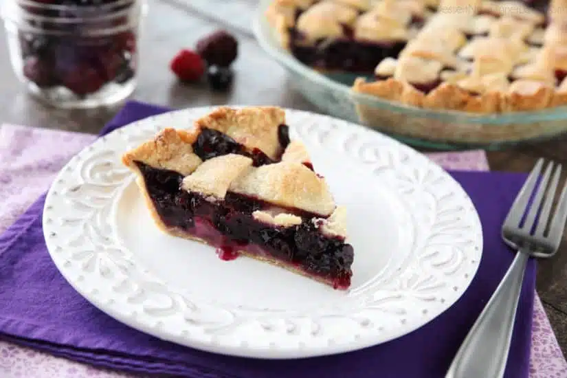 This Mixed Berry Pie uses a frozen blend of raspberries, blackberries, and blueberries which is perfect when fresh berries are out of season. No need to cook the filling ahead of time. Simply fill and bake. Enjoy this pie for the holidays or any day of the year!