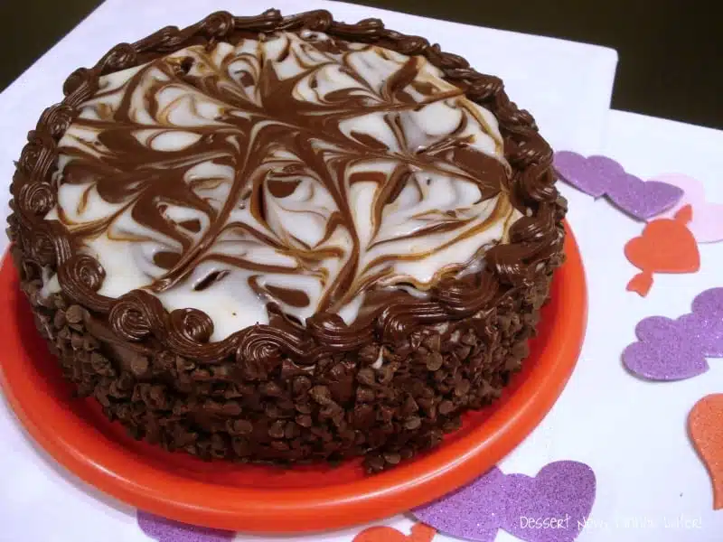 Full Black Tie Mousse Cake on plate.