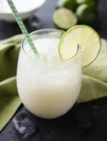 Brazilian Lemonade is actually a creamy limeade that is perfectly sweet and slightly tangy. The secret ingredient that makes it creamy will have you pouring glass after glass of this refreshing drink. Perfect for hot summer days, parties, and potlucks!