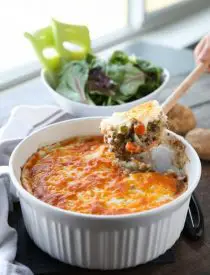 This Shepherd's Pie is a hearty and simple dinner made with ground beef and veggies in a flavorful broth topped with fluffy garlic mashed potatoes and a sprinkle of cheese. Classic comfort food for cold weather months or to celebrate St. Patrick's Day.