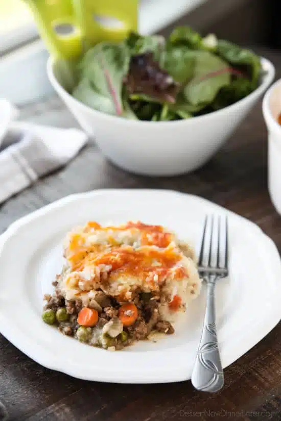 This Shepherd's Pie is a hearty and simple dinner made with ground beef and veggies in a flavorful broth topped with fluffy garlic mashed potatoes and a sprinkle of cheese. Classic comfort food for cold weather months or to celebrate St. Patrick's Day.