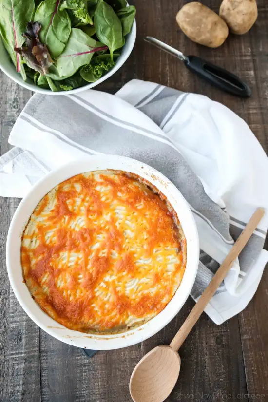 This Shepherd's Pie is a hearty and simple dinner made with ground beef and veggies in a flavorful broth topped with fluffy garlic mashed potatoes and a sprinkle of cheese. Classic comfort food for cold weather months or to celebrate St. Patrick's Day.