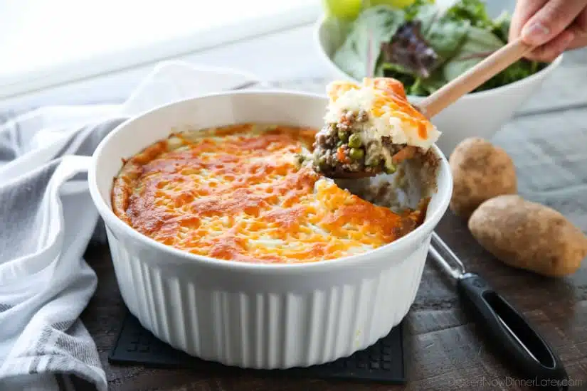 This Shepherd's Pie is a hearty and simple dinner made with ground beef and veggies in a flavorful broth topped with fluffy garlic mashed potatoes and a sprinkle of cheese. Classic comfort food for cold weather months or to celebrate St. Patrick's Day.