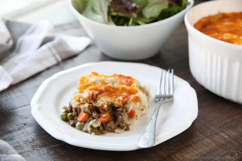 This Shepherd's Pie is a hearty and simple dinner made with ground beef and veggies in a flavorful broth topped with fluffy garlic mashed potatoes and a sprinkle of cheese. Classic comfort food for cold weather months or to celebrate St. Patrick's Day.