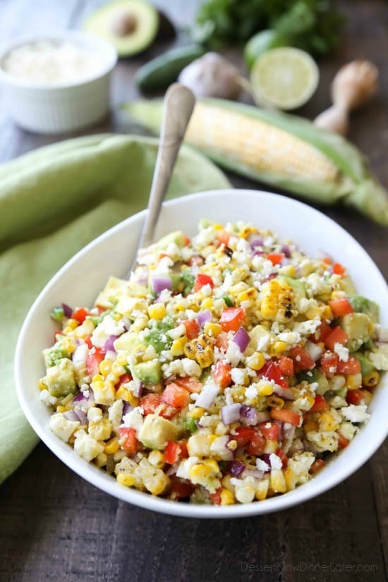 Corn Salad with Queso Fresco is loaded with grilled corn, crisp onions and peppers, and creamy avocado, all topped with a homemade cilantro lime vinaigrette and generous helping of delicious queso fresco. A great side dish for your summer barbecue.