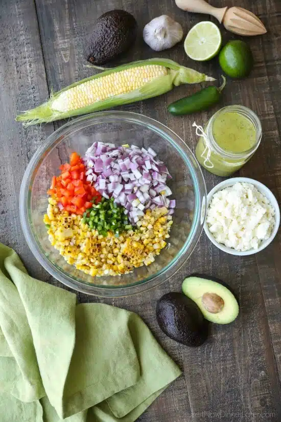 This summer Corn Salad with Queso Fresco is loaded with grilled corn, crisp onions and peppers, and creamy avocado, all topped with a homemade cilantro lime vinaigrette and generous helping of delicious queso fresco. 