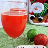This Holiday Punch has tropical flavors, fruit juice, and club soda for a fizzy, fruity, red punch! (Lighter version also available!)