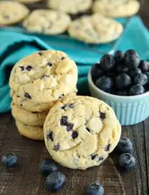 Blueberry Cheesecake Cookies are made with a muffin mix for a fruity, soft, and chewy cookie studded with creamy white chocolate chips. A quick and easy dessert!