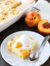 Peach cobbler meets cheesecake in this delicious dessert duo! An easy and unique twist from a traditional peach cobbler. There's cake mixture on bottom and on top, with peaches and cheesecake in-between.