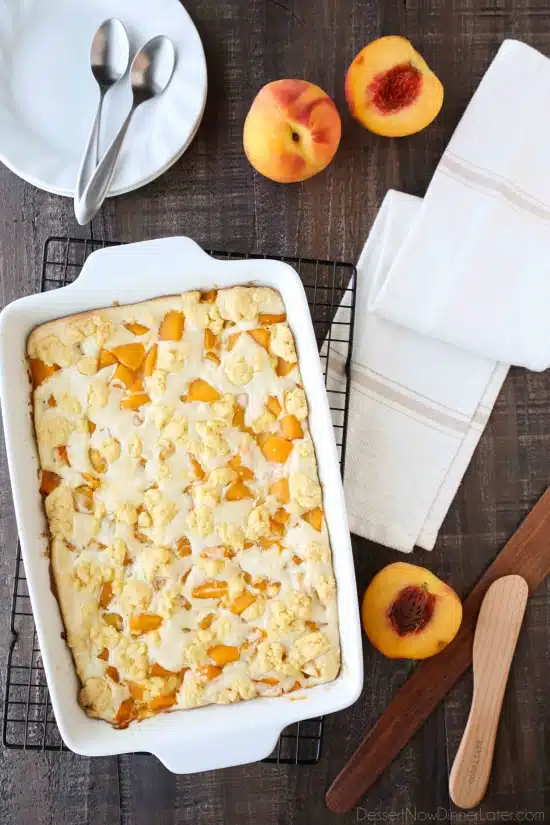 Peach cobbler meets cheesecake in this delicious dessert duo! An easy and unique twist from a traditional peach cobbler. There's cake mixture on bottom and on top, with peaches and cheesecake in-between.