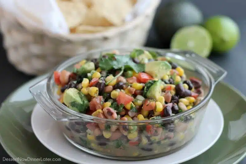 Cowboy Caviar is a chunky salsa-type dip with beans, avocado, tomatoes, corn and a zesty dressing. Great for picnics, potlucks, parties, or a game day snack!