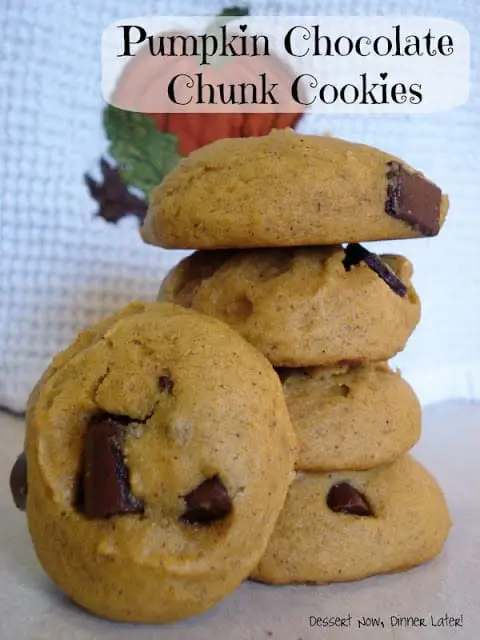 Stack of pumpkin cookies with chocolate chunks.