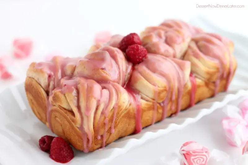 Raspberry butterflake loaf covered in glaze.