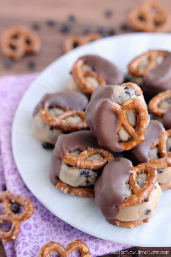 Cookie Dough Pretzel Bites - eggless chocolate chip cookie dough sandwiched between two pretzels and dipped in milk chocolate! From DessertNowDinnerLater.com