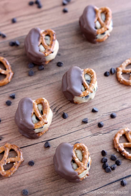 Cookie Dough Pretzel Bites - eggless chocolate chip cookie dough sandwiched between two pretzels and dipped in milk chocolate! From DessertNowDinnerLater.com