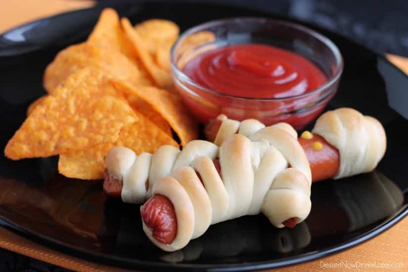 Hot Dog Mummies are a fun Halloween food your kids can help make! (Step-by-step photo tutorial available.)