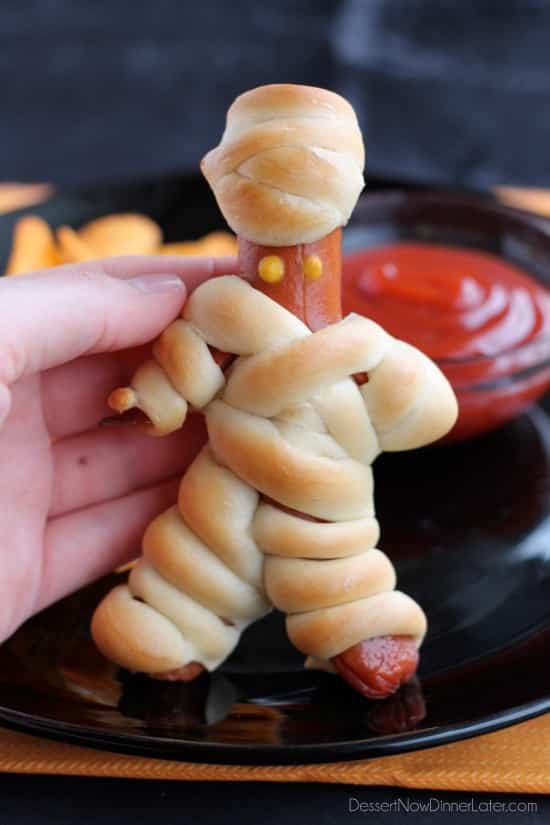 Hot Dog Mummies are a fun Halloween food your kids can help make! (Step-by-step photo tutorial available.)