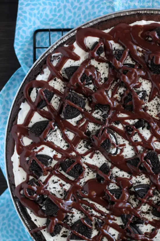 Oreo Fudge Brownie Pizza – These brownies are for the Oreo lovers! There are plenty of Oreo’s inside and out of this dessert pizza, topped with a marshmallow fluff frosting and drizzled in fudge sauce. From DessertNowDinnerLater.com