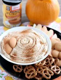 Pumpkin Cheesecake Dip is super simple to make and is great with apples, vanilla wafers, pretzels and more! From DessertNowDinnerLater.com