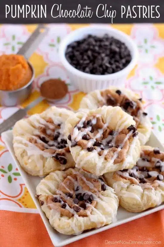 Pumpkin Chocolate Chip Pastries are made with frozen puff pastry dough, a spiced pumpkin cream cheese, and mini chocolate chips!  They are especially delicious warm from the oven with a powdered sugar glaze! From DessertNowDinnerLater.com