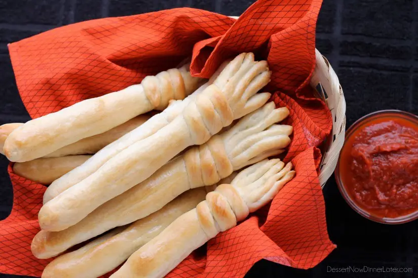 Witch's Broomstick Breadsticks made with frozen roll dough. Great served with marinara or soup! From DessertNowDinnerLater.com #halloween