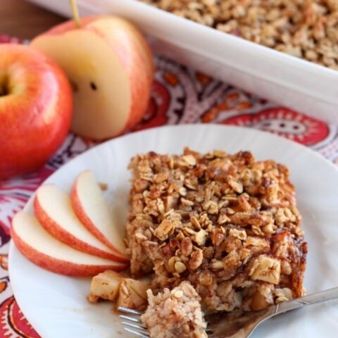 Apple Cinnamon Baked Oatmeal - old fashioned oats, agave, and apples are just a few of the delicious ingredients used in this lighter baked oatmeal. From DessertNowDinnerLater.com