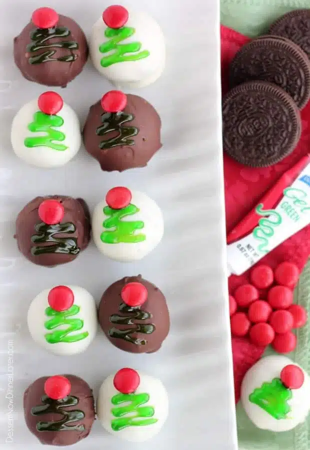 These traditionally made OREO Cookie Balls are decorated with green gel and a red candy coated chocolate piece for a festive Christmas Tree treat! From DessertNowDinnerLater.com