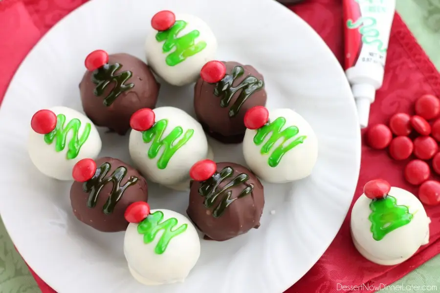 These traditionally made OREO Cookie Balls are decorated with green gel and a red candy coated chocolate piece for a festive Christmas Tree treat! From DessertNowDinnerLater.com