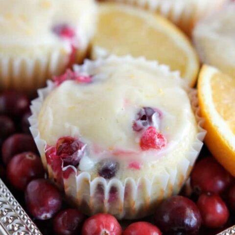 Homemade Cranberry Orange Muffins with plump, fresh cranberries, orange juice and zest, topped with an orange glaze! From DessertNowDinnerLater.com