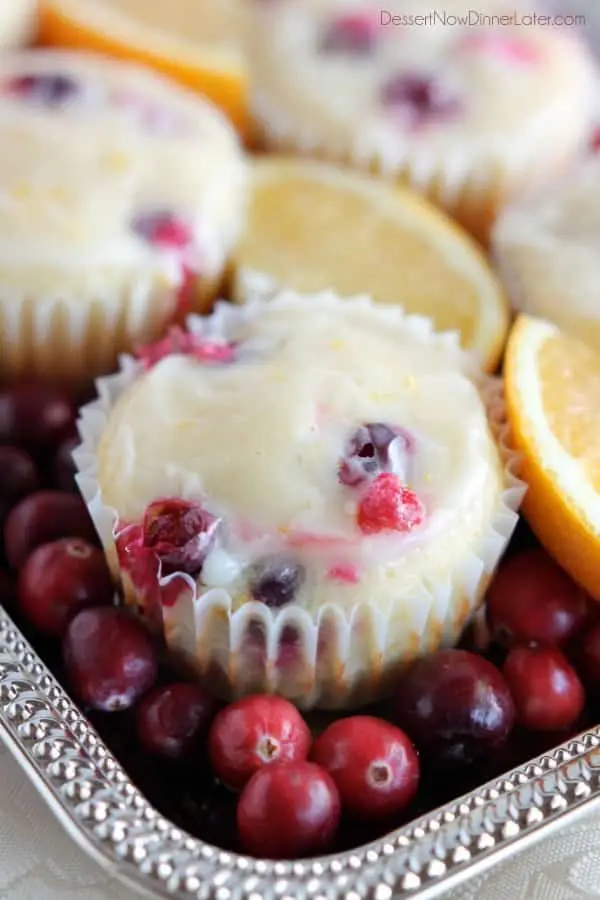 Homemade Cranberry Orange Muffins with plump, fresh cranberries, orange juice and zest, topped with an orange glaze! From DessertNowDinnerLater.com