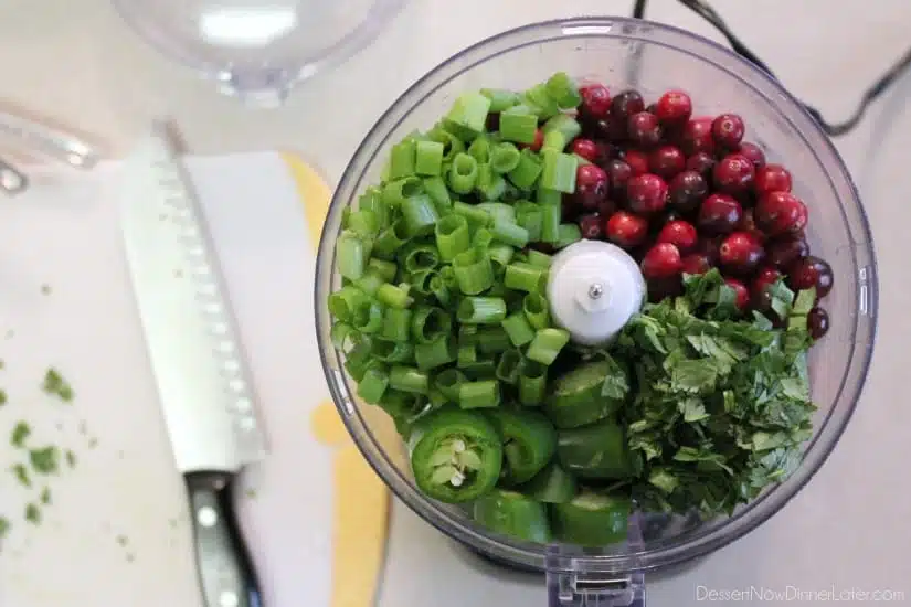 This fresh Cranberry Salsa is pureed and served over cream cheese for a spicy-sweet appetizer. From DessertNowDinnerLater.com