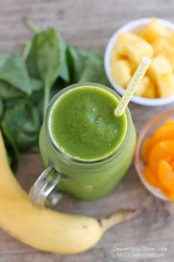 This Pineapple Orange Banana Green Smoothie is fruity and refreshing with chia seeds and spinach to add fiber and protein for additional nutrition! From DessertNowDinnerLater.com