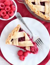 This Raspberry Pie can be made with frozen or fresh raspberries for a vibrant and delicious fruit pie! From DessertNowDinnerLater.com