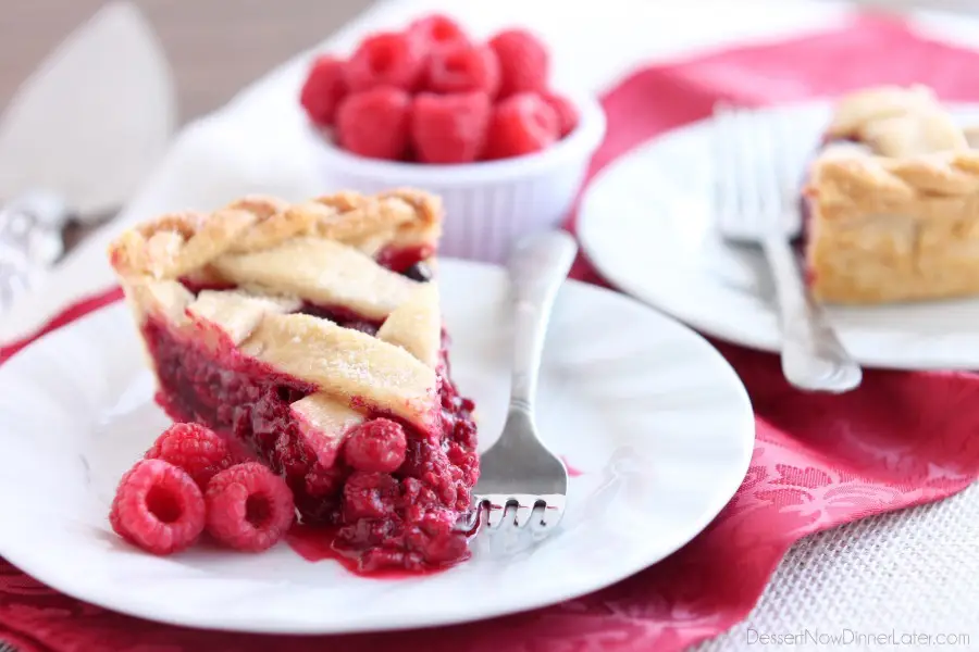 This Raspberry Pie can be made with frozen or fresh raspberries for a vibrant and delicious fruit pie! From DessertNowDinnerLater.com