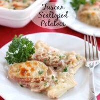 Tuscan Scalloped Potatoes - Thinly sliced potatoes covered in a simple Tuscan seasoned sauce, topped with Parmesan and Mozzarella cheeses, then baked and browned to perfection! From DessertNowDinnerLater.com
