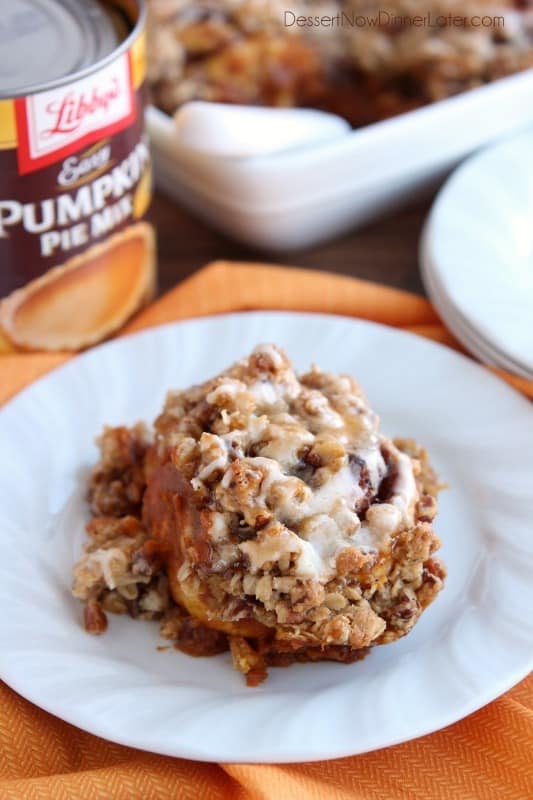 Cinnamon Pumpkin Crumble - frozen cinnamon rolls smothered in pumpkin pie mix, spices, and a crispy-crunchy streusel, then baked to perfection and served with a drizzle of cream cheese frosting and caramel!