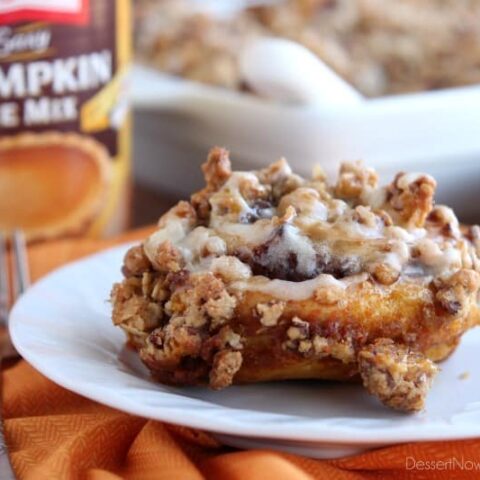 Cinnamon Pumpkin Crumble - frozen cinnamon rolls smothered in pumpkin pie mix, spices, and a crispy-crunchy streusel, then baked to perfection and served with a drizzle of cream cheese frosting and caramel!