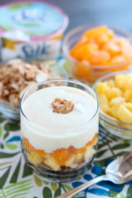 Enjoy this Dairy-Free Tropical Parfait with a homemade honey almond coconut granola base, layers of pineapple and mandarin oranges, all topped with a creamy-textured, smooth Dairy-Free Yogurt Alternative from Silk!