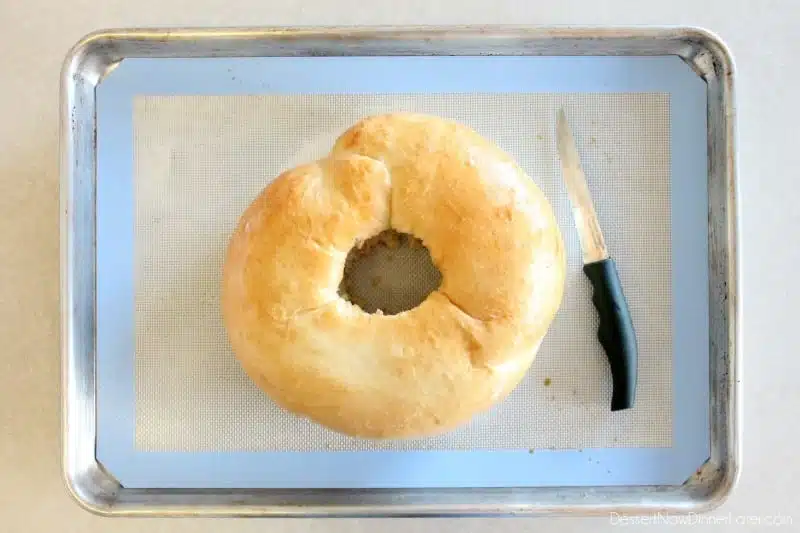 This New Year’s Party Loaf is filled with honey butter, topped with a powdered sugar glaze, and made to sparkle with edible silver and gold pearlized sugar sprinkles.