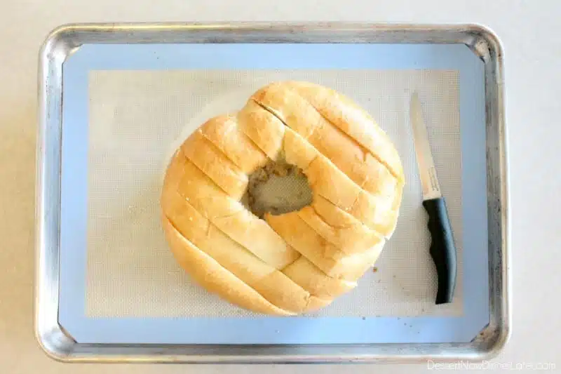 This New Year’s Party Loaf is filled with honey butter, topped with a powdered sugar glaze, and made to sparkle with edible silver and gold pearlized sugar sprinkles.