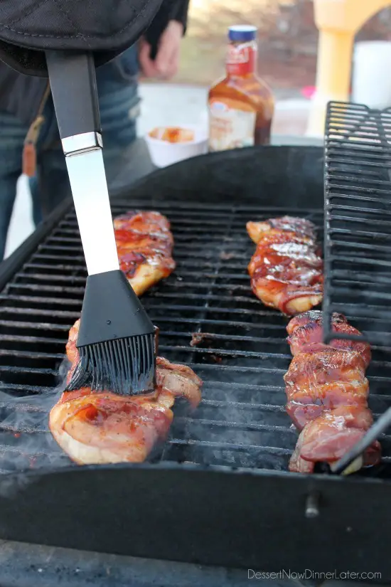 Using the Evergriller Grill 'N' Flip Mitt to keep warm while grilling outside in the cold!