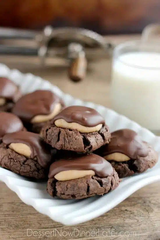 Buckeye Cookies - a chocolate brownie cookie base, topped with peanut butter balls, all covered in chocolate! These are insanely delicious!