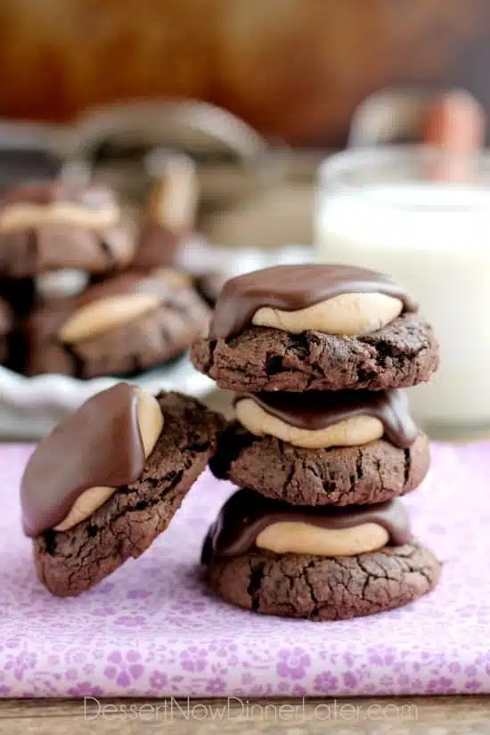 Buckeye Cookies - a chocolate brownie cookie base, topped with peanut butter balls, all covered in chocolate! These are insanely delicious!