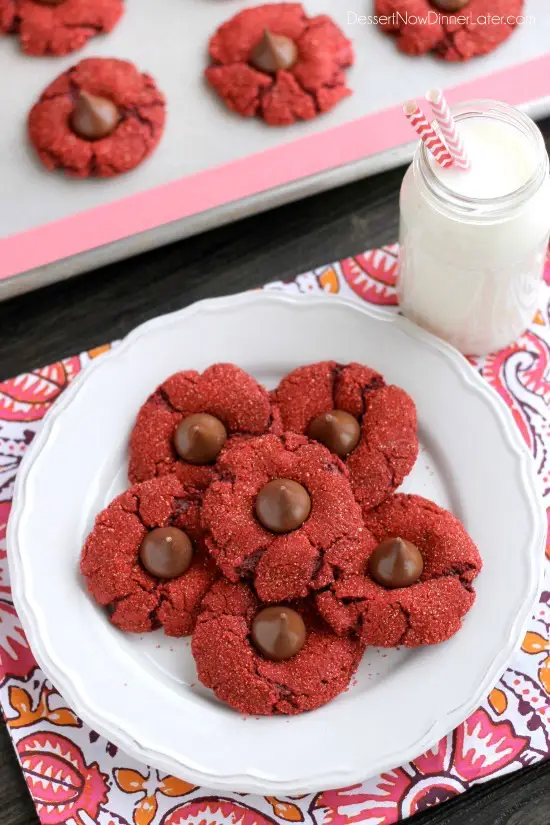 Red velvet blossom cookies with Hershey's chocolate kisses in the center.