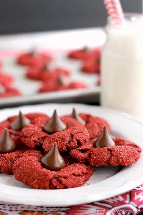 Red velvet blossom cookies with Hershey's chocolate kisses in the center.