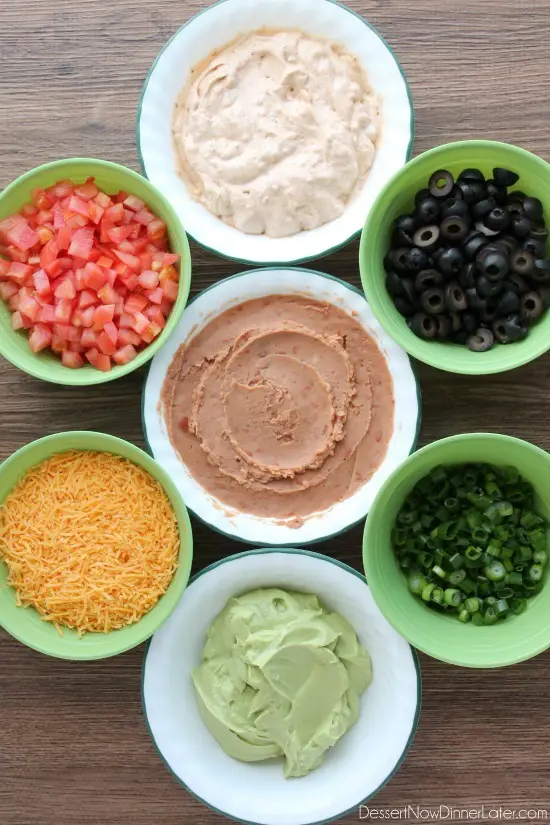Seven Layer Dip is a classic party snack or football food. This version has a secret ingredient to make it a dip that is sure to get gobbled up by your guests!