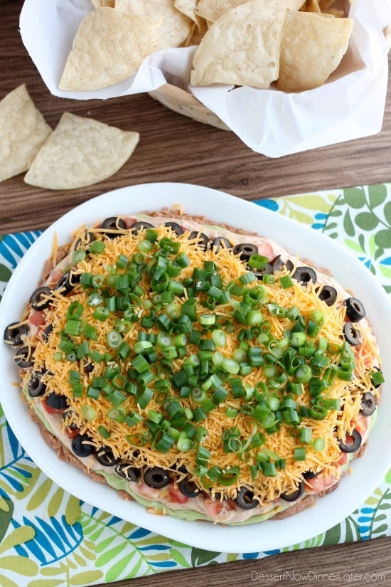 Seven Layer Dip is a classic party snack or football food. This version has a secret ingredient to make it a dip that is sure to get gobbled up by your guests!